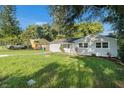 Newly renovated house with a large grassy yard at 7202 N 21St St, Tampa, FL 33610