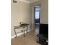 Living room with TV and access to bedroom at 8615 Mallard Reserve Dr # 102, Tampa, FL 33614