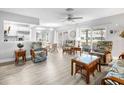 Bright living room with wicker furniture and a view to the patio at 141 Glendower Cir # 250, Sun City Center, FL 33573