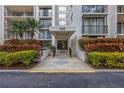 Inviting building entrance featuring well-maintained landscaping and prominent address display at 220 Belleview Blvd # 108, Belleair, FL 33756