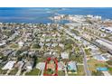 Aerial view of home with a large body of water in the background at 2480 Baywood E Dr, Dunedin, FL 34698
