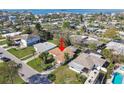 Enjoy the serenity of this neighborhood from above, where the sky meets a vibrant community at 2480 Baywood E Dr, Dunedin, FL 34698