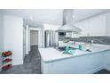Modern kitchen with stainless steel appliances and white cabinets at 2835 Freemont S Ter, St Petersburg, FL 33712