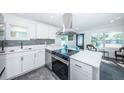 Modern kitchen features stainless steel appliances and white shaker cabinets at 2835 Freemont S Ter, St Petersburg, FL 33712