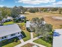 Expansive aerial shot showcasing a beautiful community with lush landscaping and well-maintained homes in a serene setting at 301 Andover S Pl # 185, Sun City Center, FL 33573