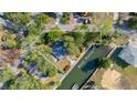Aerial view highlighting a home's canal-front location and private boat ramp access at 6119 Beacon Point Dr, Weeki Wachee, FL 34607