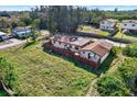 Aerial view of fenced backyard featuring a lush lawn and mature trees offering privacy at 10455 14Th Ne St, St Petersburg, FL 33702