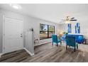 Bright living room featuring updated flooring, a large window, and modern furniture at 1217 Carmella Ln, Sarasota, FL 34243