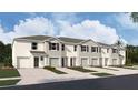 New townhome community with attached garages, and modern design at 31273 Midnight Sun Way, Wesley Chapel, FL 33545