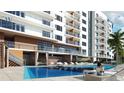 Relaxing poolside view featuring lounge chairs and resort amenities at 411 E Shore Dr # 206, Clearwater Beach, FL 33767