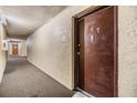 Neutral hallway leading to unit 247 with a fire extinguisher visible at 5820 N Church Ave # 247, Tampa, FL 33614