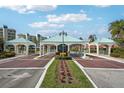 Elegant community entrance with meticulously maintained landscaping and decorative archways offering a warm welcome at 8040 Sailboat Key S Blvd # 304, St Pete Beach, FL 33707