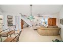 Spacious living room with stained glass light and comfy seating at 949 Hamilton Ct, Palm Harbor, FL 34683