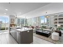 Open living space with modern kitchen, island, and city views at 145 2Nd S Ave # 523, St Petersburg, FL 33701