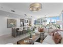 Open concept living and kitchen area with modern decor and city views at 145 2Nd S Ave # 523, St Petersburg, FL 33701