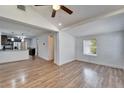 Spacious living room with hardwood floors and kitchen view at 3005 E Shadowlawn Ave, Tampa, FL 33610