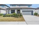 Beautiful two-story home featuring well-maintained landscaping, offering curb appeal and a welcoming ambiance at 3888 Almond Brook Blvd, Land O Lakes, FL 34638