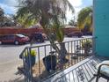 View from the porch shows well-maintained landscaping and off-street parking at 4140 55Th N St # 1115, Kenneth City, FL 33709