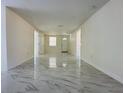 Bright living area with marble-look floors at 5152 Filbert St, Zephyrhills, FL 33541