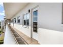 Condo building exterior featuring pathway and unit 512's front door at 5603 80Th N St # 512, St Petersburg, FL 33709
