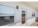 Condo exterior featuring front door, unit number 512, and windows at 5603 80Th N St # 512, St Petersburg, FL 33709