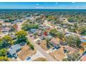 Expansive aerial shot showcasing the property's location within a leafy neighborhood and its proximity to local amenities at 10261 Horizon Dr, Spring Hill, FL 34608