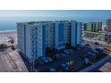 Aerial view of the Sea Breeze condo building and beach access in a desirable waterfront community at 13500 Gulf Blvd # 702, Madeira Beach, FL 33708