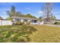 Lovely one-story home with blue shutters, lush landscaping, and a charming curb appeal at 2819 47Th S Ave, St Petersburg, FL 33712