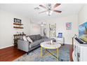 Comfortable living room with a plush gray sectional, modern furniture, and stylish decor at 2819 47Th S Ave, St Petersburg, FL 33712