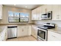 Spacious kitchen with granite countertops and stainless steel appliances at 3241 Rogue St, North Port, FL 34291