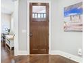 Welcoming entryway with a solid wood door and views of a home office at 415 5Th N St, Safety Harbor, FL 34695