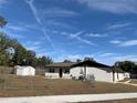 Fenced backyard with a storage shed provides ample private outdoor space at 5729 13Th St, Zephyrhills, FL 33542