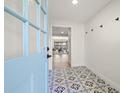 Inviting entryway with decorative tile flooring and a view into the open-concept living space at 6121 38Th W Ave, Bradenton, FL 34209