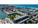 Aerial view shows location of neighborhood in relation to beach, restaurants and the Gulf of Mexico at 120 60Th Ave, St Pete Beach, FL 33706