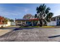 Charming single story home with stone veneer, tile roof, solar panels and a well-maintained front yard at 120 60Th Ave, St Pete Beach, FL 33706