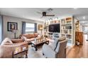 Bright living room featuring custom built-in shelving and modern track lighting at 147 Se Lincoln N Cir, St Petersburg, FL 33703