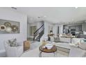 Spacious living room featuring an open floor plan and easy access to the kitchen at 36424 Sespe Creek Ct, Zephyrhills, FL 33540
