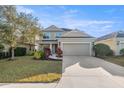 Charming two-story home with a well-manicured lawn and a spacious two-car garage at 4509 Golden Gate Cv, Bradenton, FL 34211