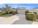 Charming two-story home with a well-manicured lawn and a spacious two-car garage at 4509 Golden Gate Cv, Bradenton, FL 34211