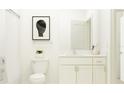 Clean bathroom with white vanity, framed mirror, and combined shower and tub at 6841 E 115Th St, Palmetto, FL 34221