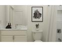 Clean bathroom featuring sleek vanity, modern fixtures, and an elegant white subway tile shower at 7529 E 116Th St, Palmetto, FL 34221