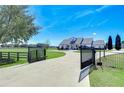 Home with gated entrance and circular driveway at 18531 Lithia Ranch Rd, Lithia, FL 33547