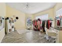 Bright bedroom with ample space, featuring wood floors, bright lighting, and versatile potential for layout at 2799 Wesleyan Dr, Palm Harbor, FL 34684