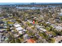 Aerial view of the neighborhood showcasing mature trees, nearby lake, and beautiful homes at 4134 Des Moines Ne St, St Petersburg, FL 33703