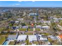 Scenic aerial shot highlighting the charming neighborhood with tree-lined streets and lush landscaping at 4134 Des Moines Ne St, St Petersburg, FL 33703