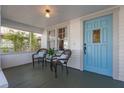 Cozy front porch with seating, light blue door, and vintage charm at 468 11Th N Ave, St Petersburg, FL 33701