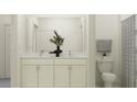 Bright bathroom featuring double sinks, a white vanity with marble countertop and a shower with a curtain at 18190 Serene Lake Loop, Lutz, FL 33548