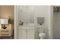 Well-lit bathroom featuring vanity with marble countertop, modern fixtures, and neutral color palette at 18190 Serene Lake Loop, Lutz, FL 33548