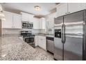 Close-up of a renovated kitchen featuring stainless steel appliances and granite countertops at 5020 16Th N Ave, St Petersburg, FL 33710