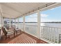 Relax on the porch and enjoy the serene waterfront view at 8448 Fantasia Park Way, Riverview, FL 33578